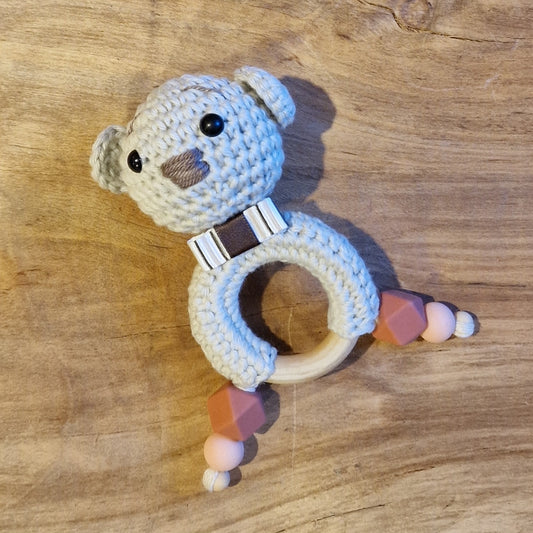 Crochet rattle for babies with a brownish butterfly (AIPU 45)