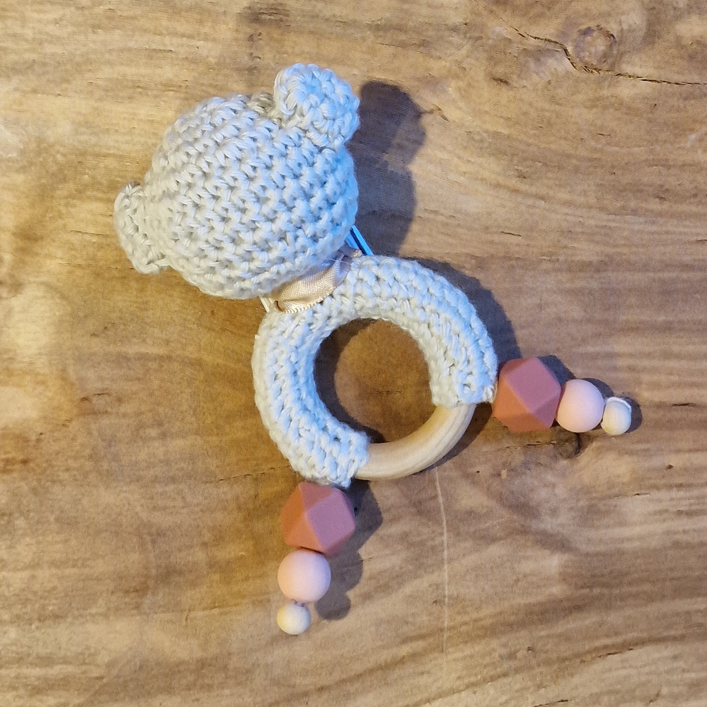Crochet rattle for babies with a brownish butterfly (AIPU 45)