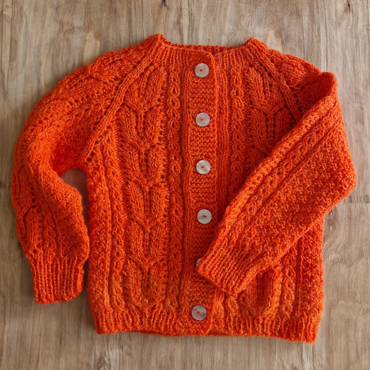 Orange knitted jacket for a child 122-134cm (DZTO 31)