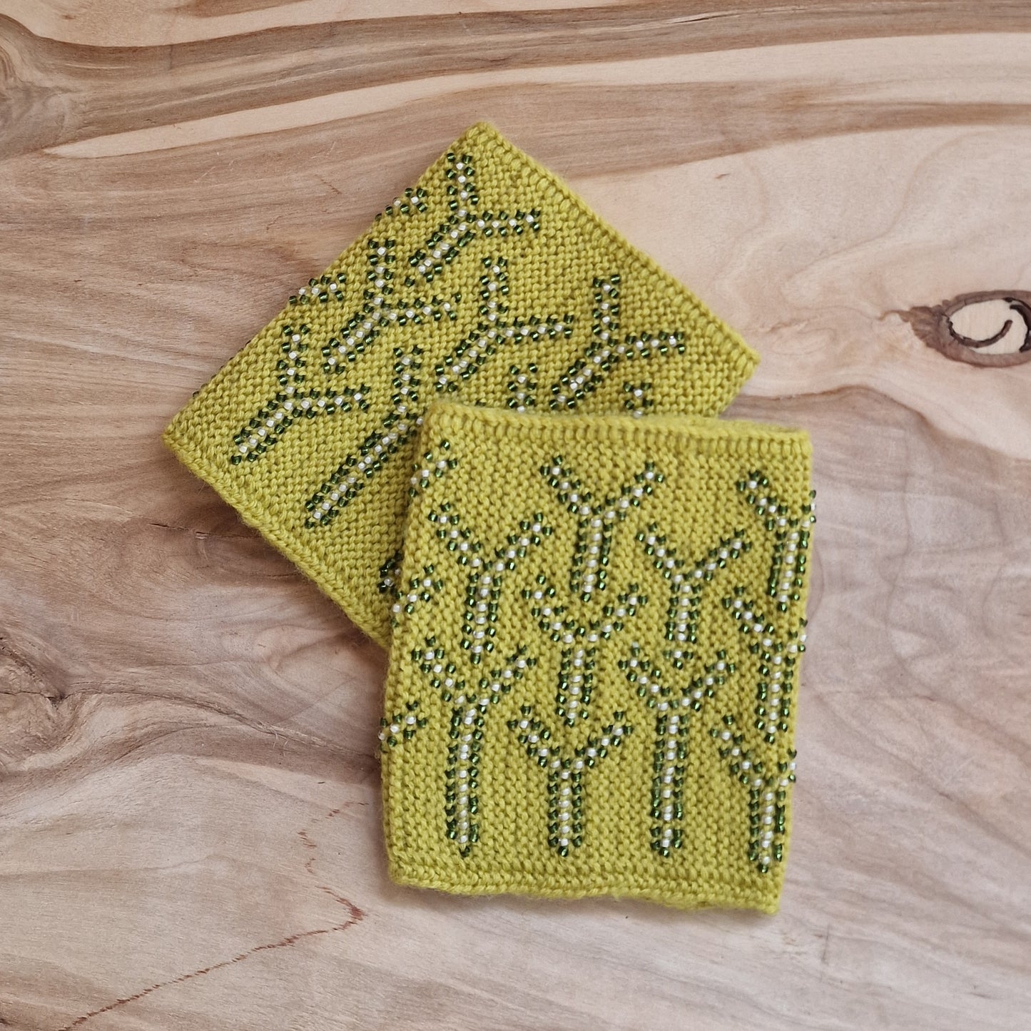 Yellow-green cuffs/pulse warmers with green and white beaded pattern (LĪLU 16)