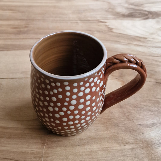 Light colored clay mug with illustrations (MASP 77)