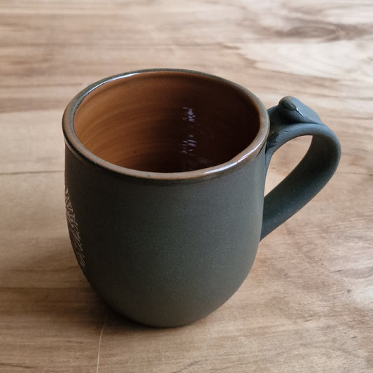 Light colored clay mug with illustrations (MASP 77)