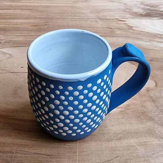 Light colored clay mug with illustrations (MASP 77)