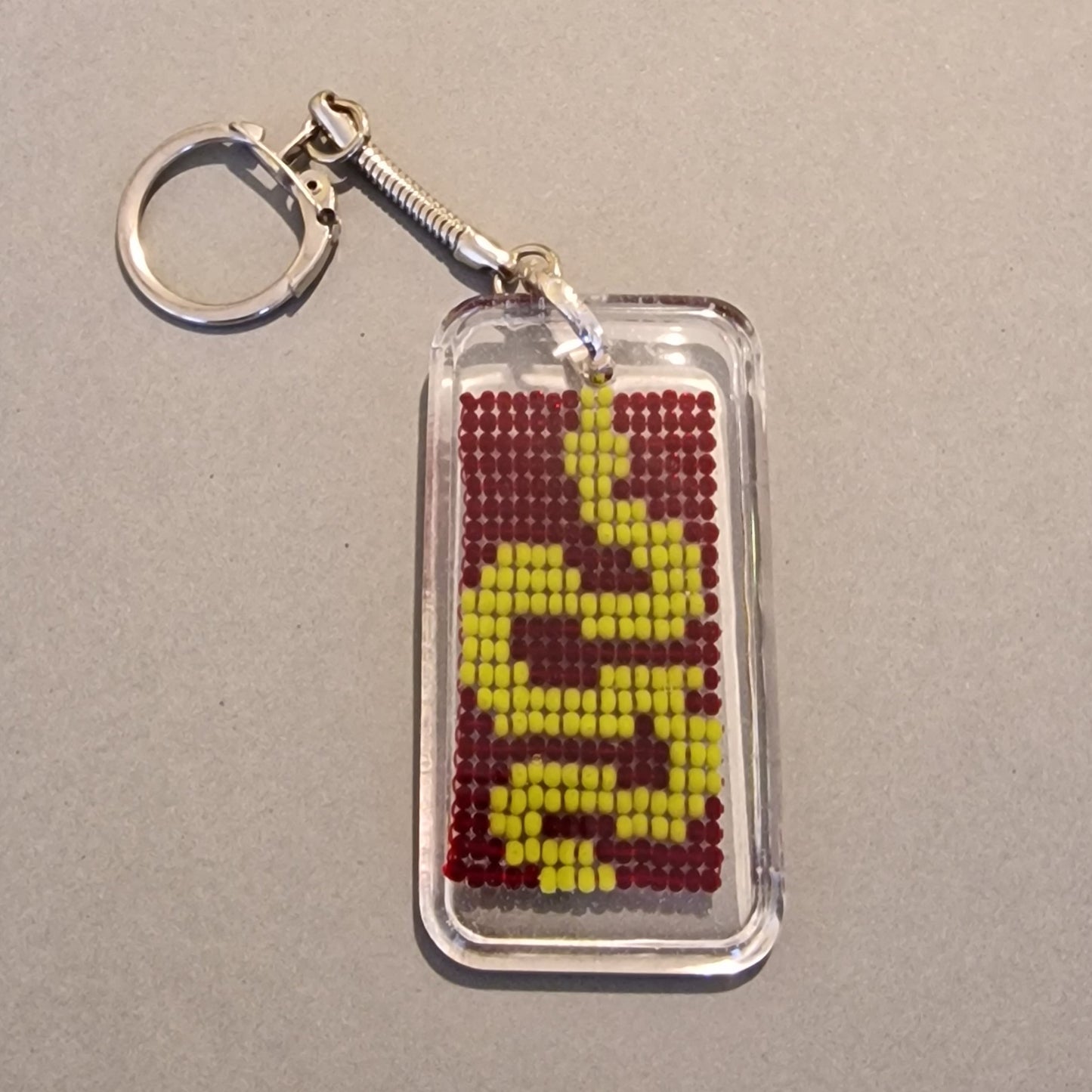 Atslēgu piekariņš "dzeltena čūska" (SPKA 59) - www.tiptip.lv 