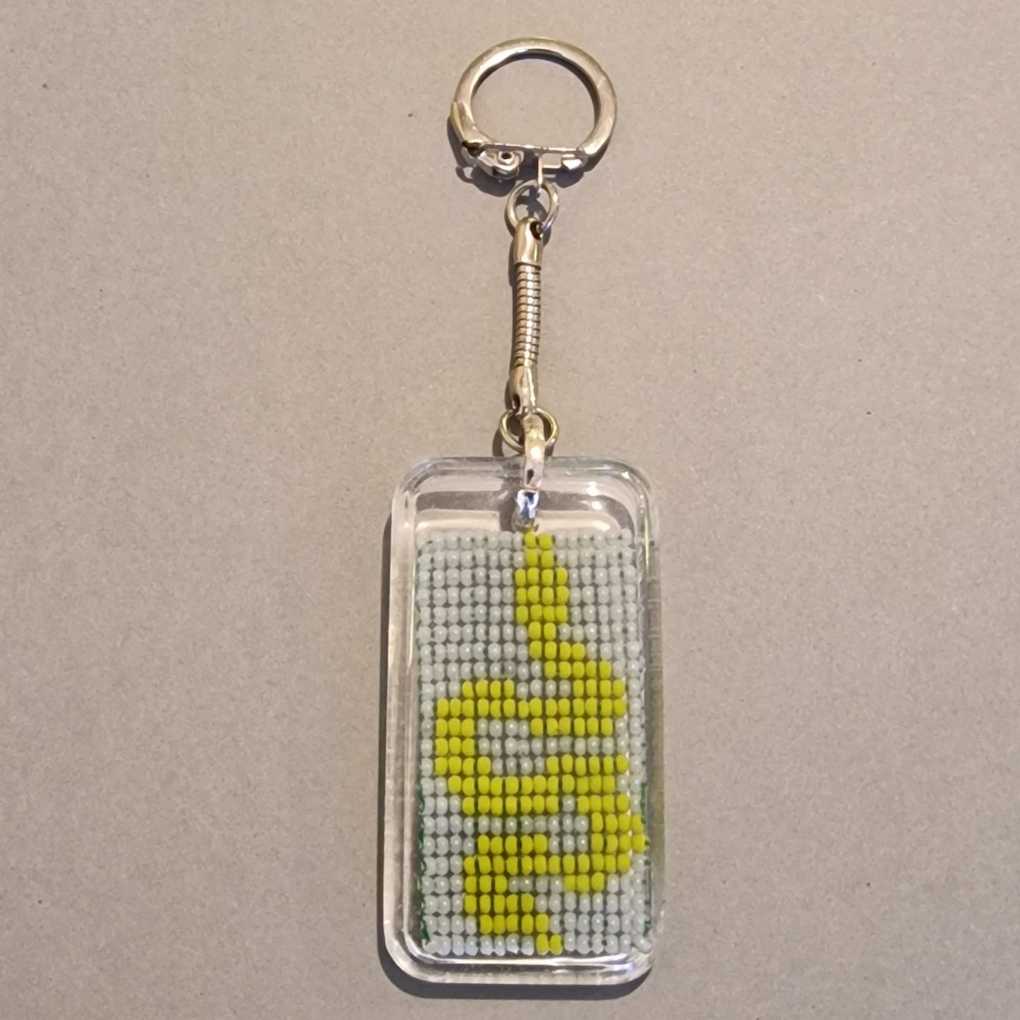 Atslēgu piekariņš "dzeltena čūska" (SPKA 63) - www.tiptip.lv 