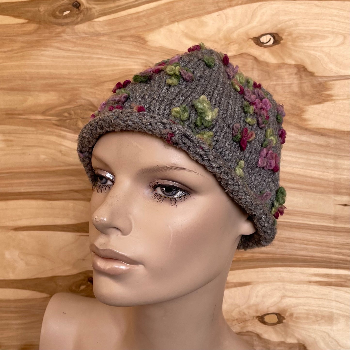 Dark gray hat with pink and green decorations (INKL 44)