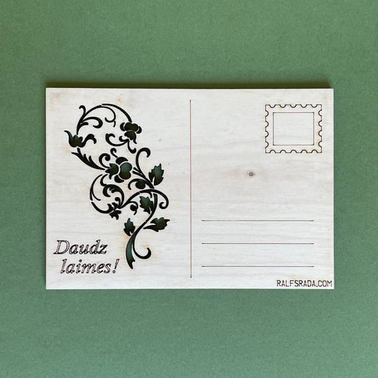 Plywood postcard with milled flowers and writing "Lots of  luck!" in Latvian (RAJO 40)