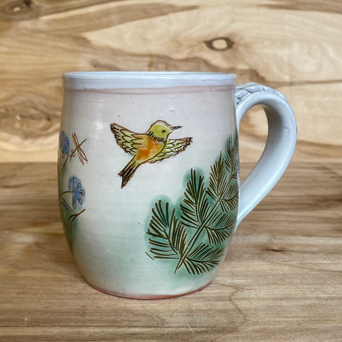 Light colored clay mug with illustrations (MASP 77)