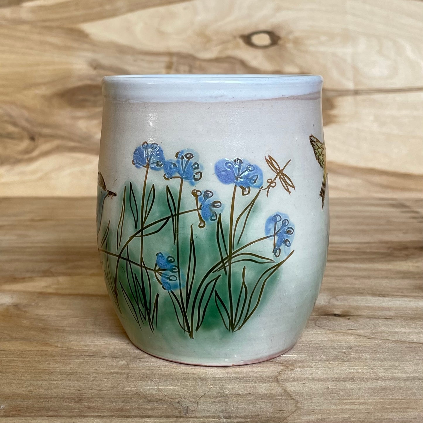 Light colored clay mug with illustrations (MASP 77)