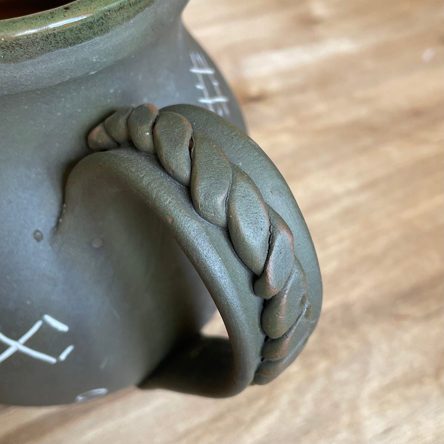 Ash gray clay pitcher with Latvian ornaments (MASP 82)