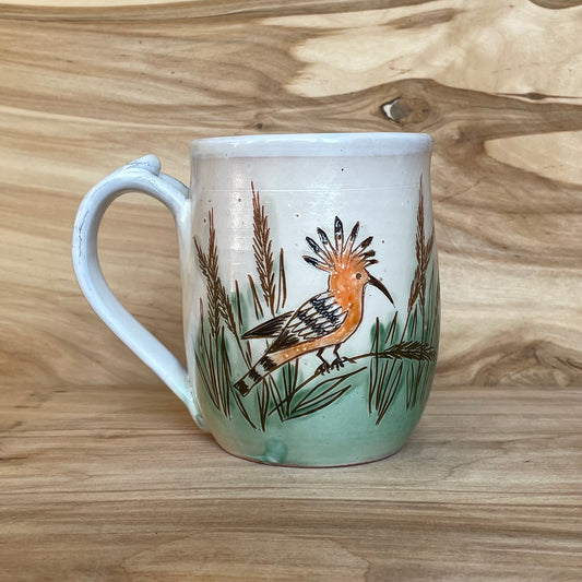 Light colored clay mug with illustrations (MASP 77)