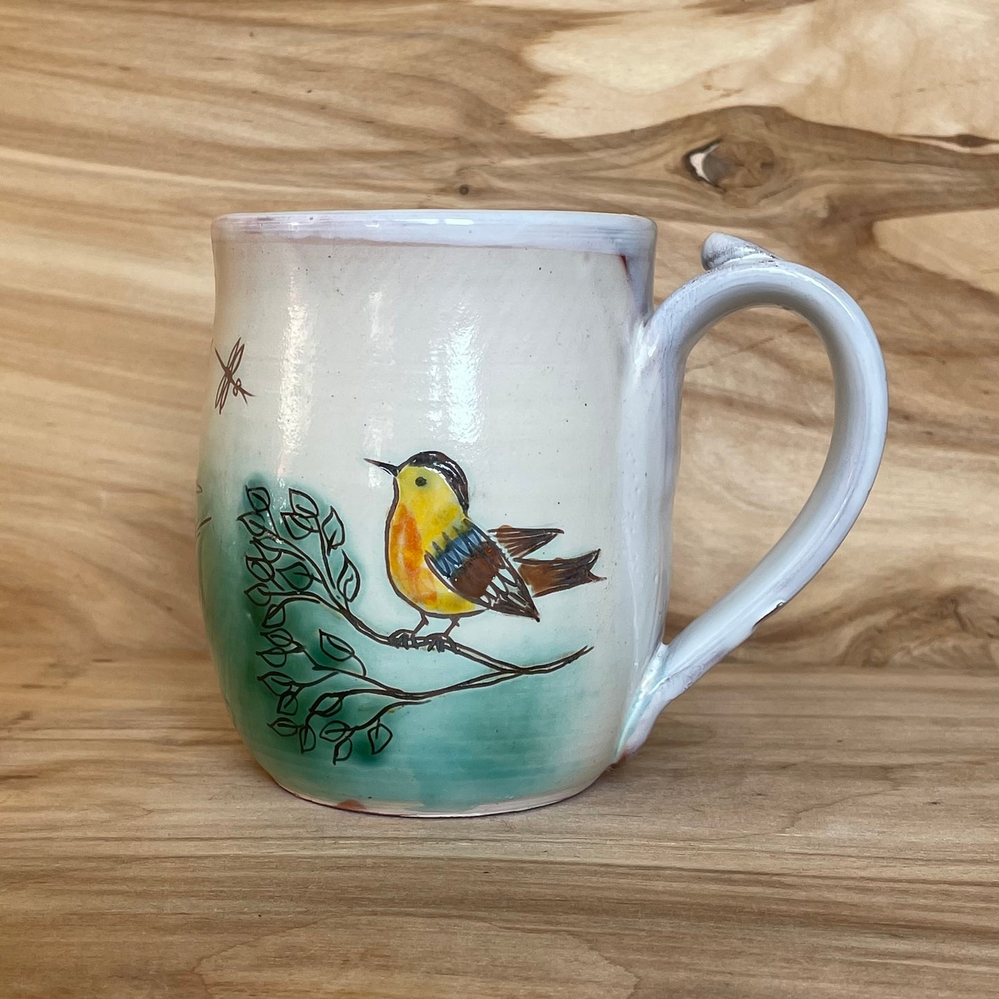 Light colored clay mug with illustrations (MASP 77)