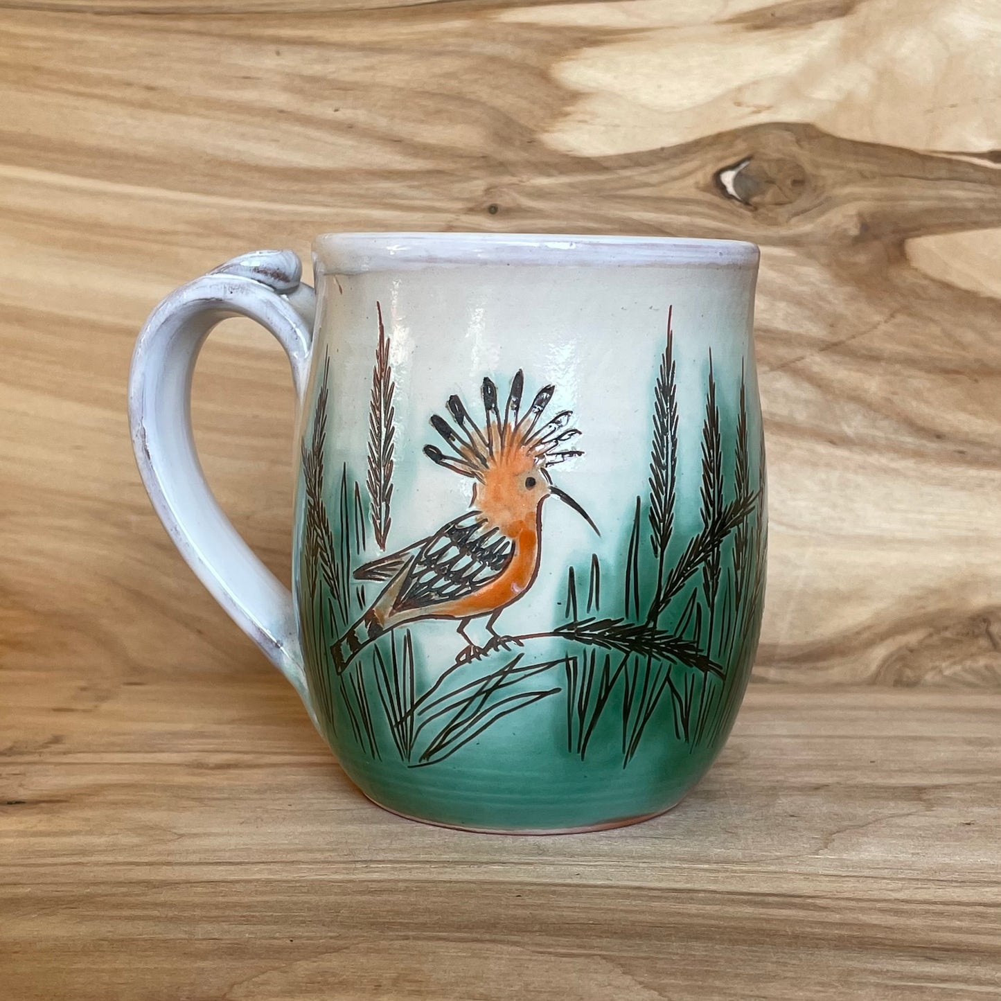 Light colored clay mug with illustrations (MASP 77)