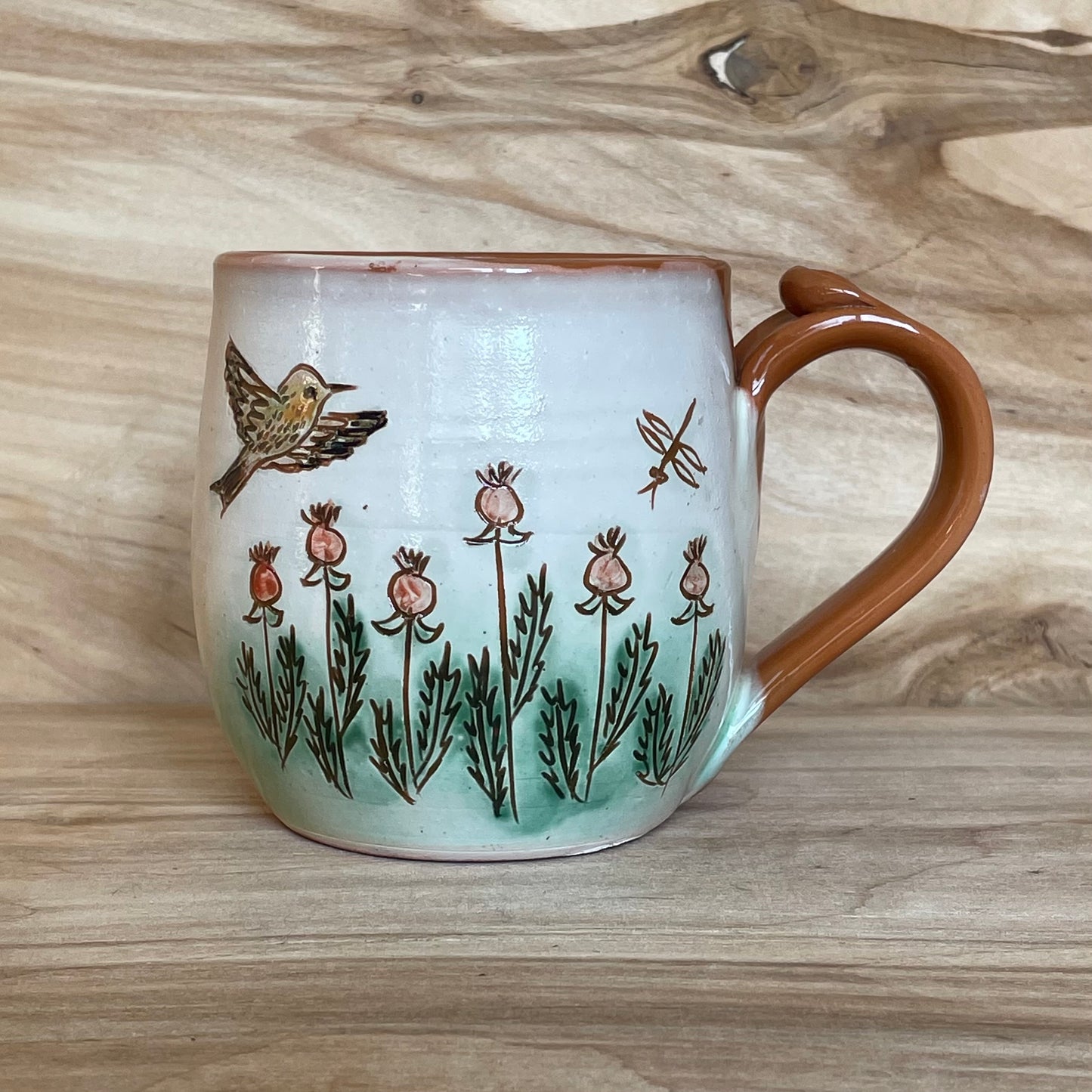 Light colored clay mug with illustrations (MASP 77)