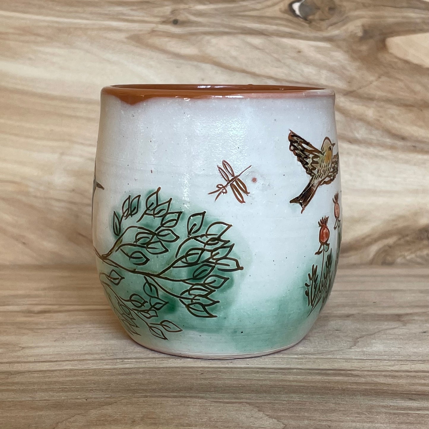 Light colored clay mug with illustrations (MASP 77)