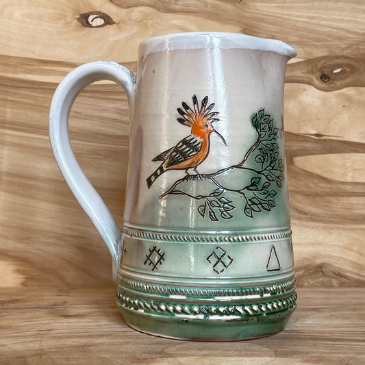 Light colored clay pitcher with illustrations (MASP 78)