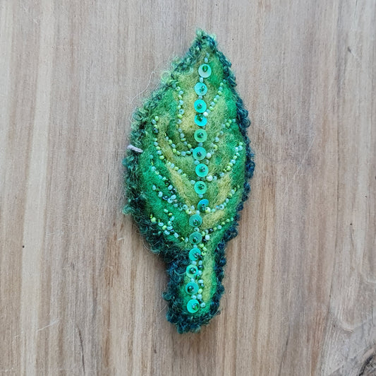 Felt brooch with pearl embroidery in shades of green 13 x 6 cm (AMA)