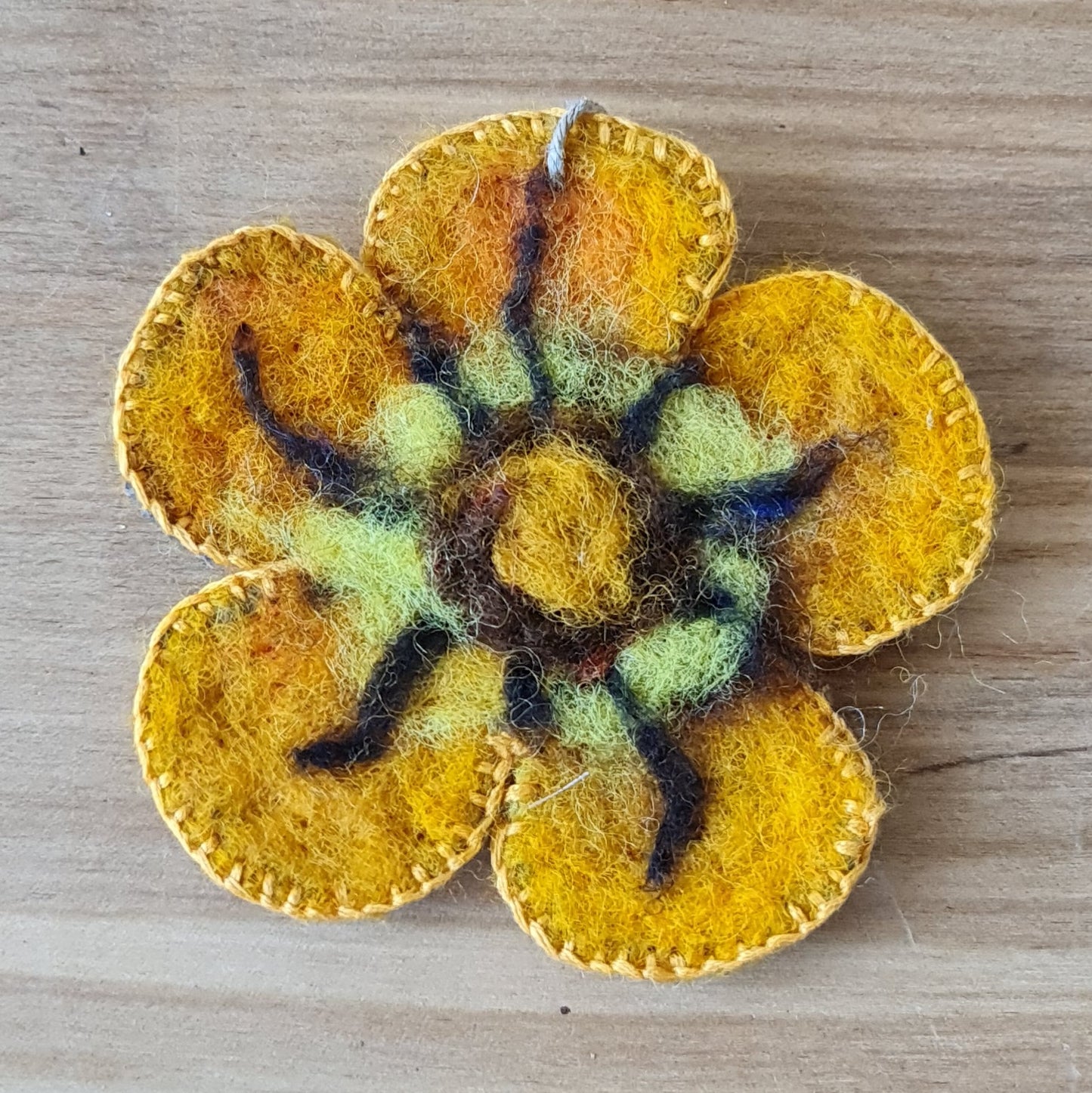 Felt flower (without pin) in yellow tones with brown linear accents / diameter 9 cm (AMA)