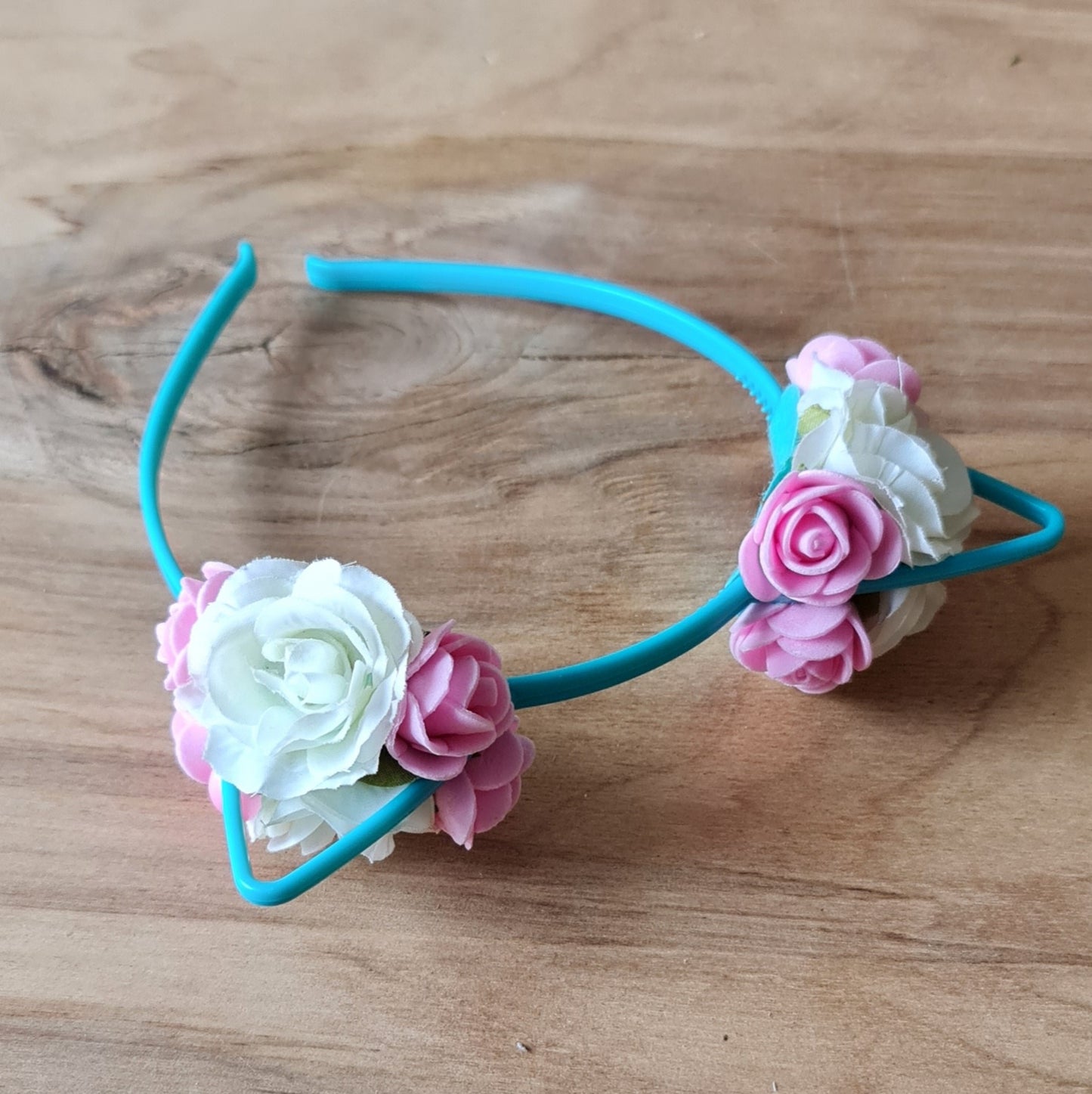 Blue-green hair band for girls with "cat ears" decorated with white and light pink flowers (APU2)