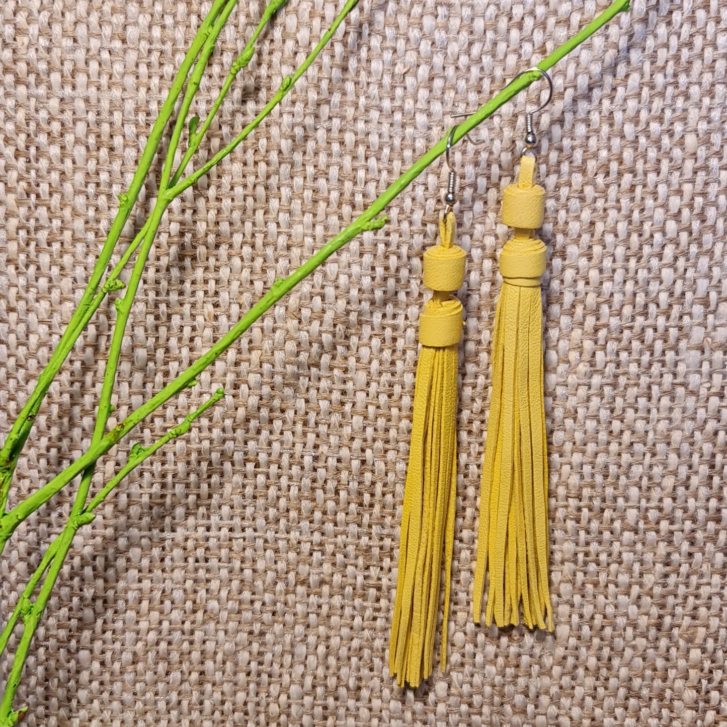 Light leather string earrings in light warm yellow color from leather strips of the same length (length 11.5 cm) top row 9th from the left (JŠČ)