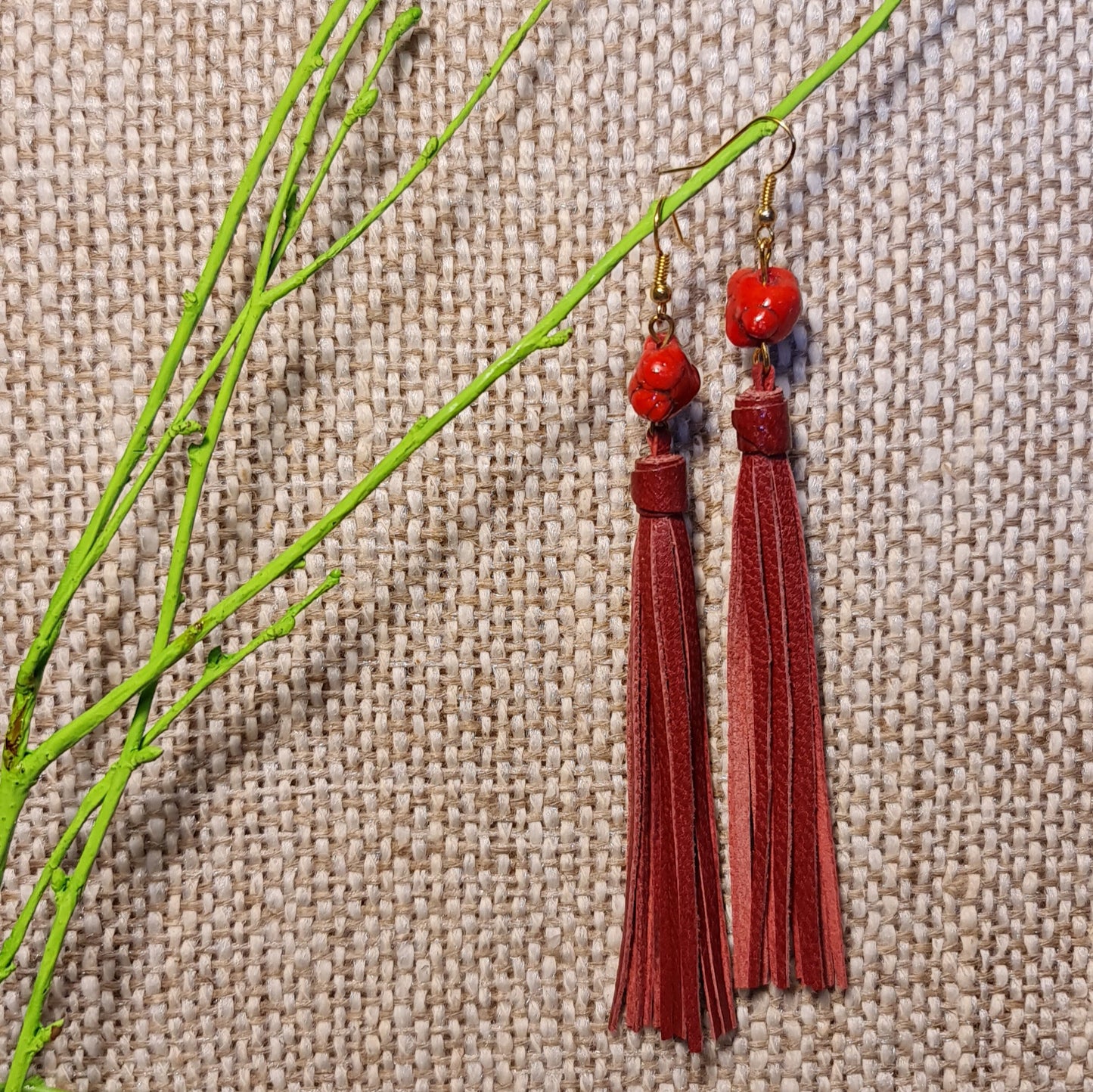 Light leather string earrings in dark red color from equal length leather strips with red stones on top (length 13 cm) bottom row 9th from the left (JŠČ)