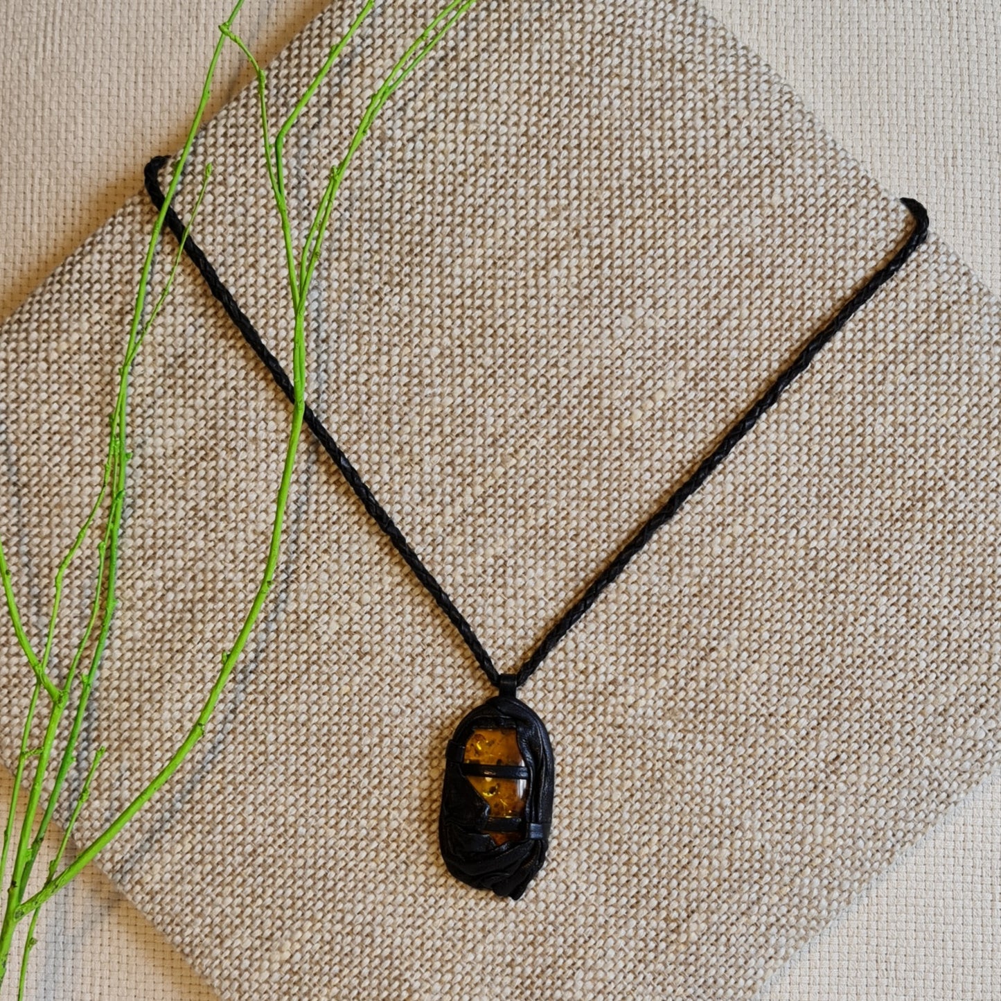 Black / light leather necklace with an amber pendant in a leather frame (length 42 cm) (JŠČ)