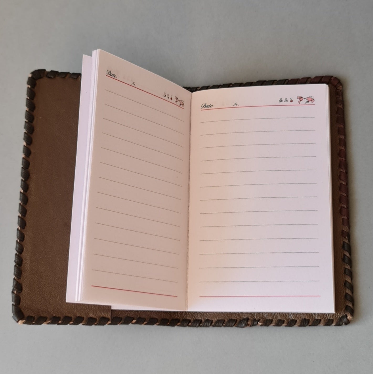 Diary. The calendar part is changeable. Brown leather covers. 8 x 13 cm (MAPL)