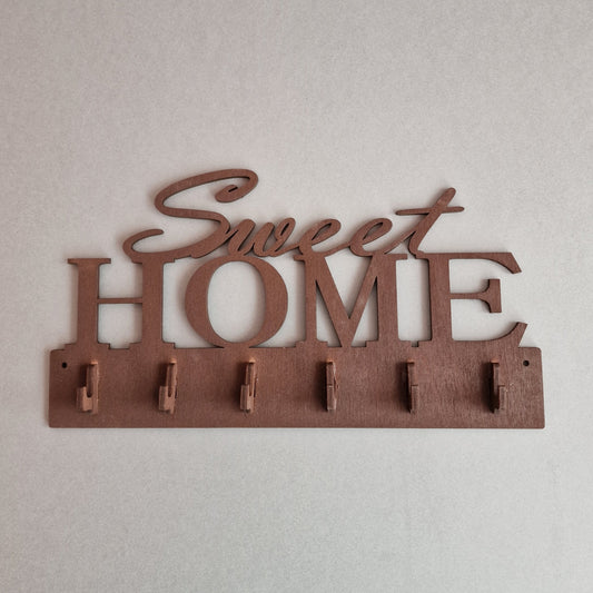 Brūns saplākšņa atslēgu pakaramais "Sweet Home" ar 6 āķīšiem 25x13.5 cm (RAJO 39)