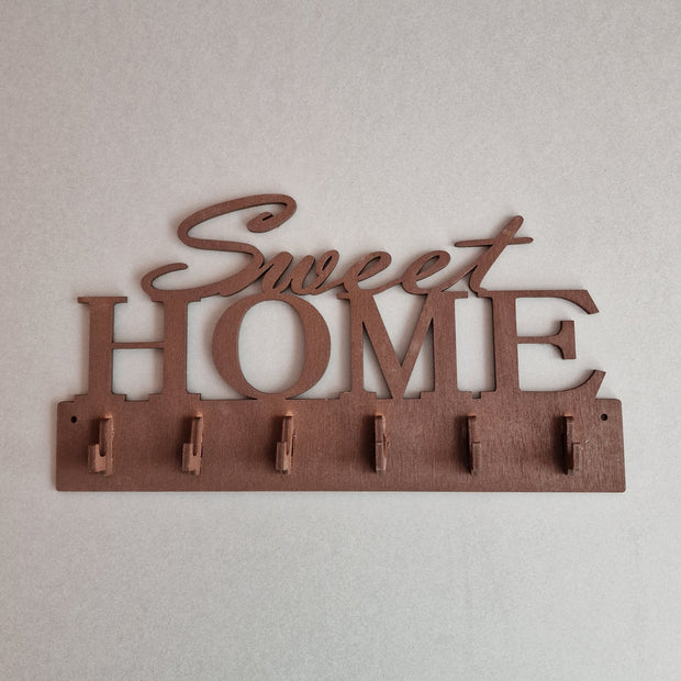 Brūns saplākšņa atslēgu pakaramais "Sweet Home" ar 6 āķīšiem 25x13.5 cm (RAJO)