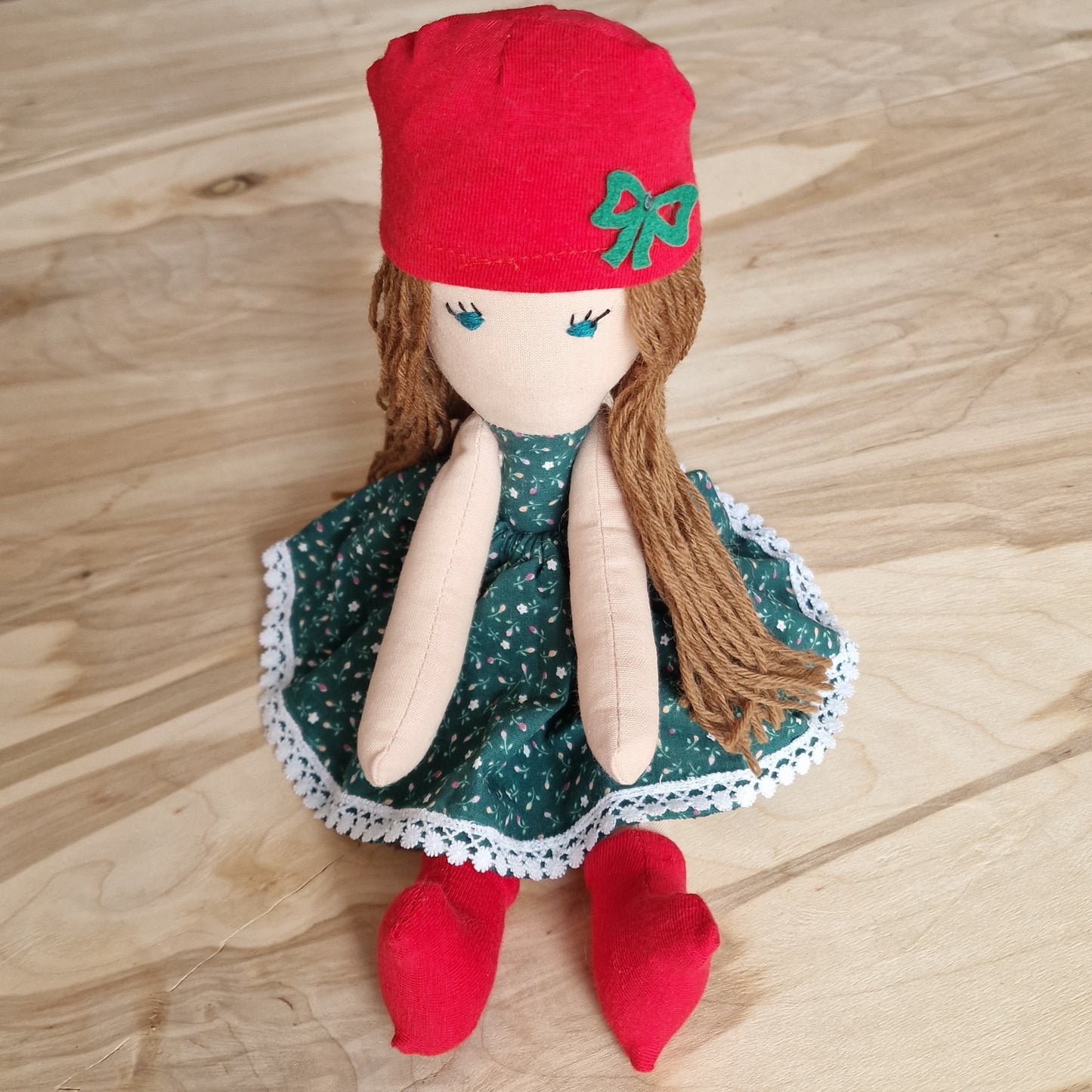 Hand-sewn cotton doll with a red hat (IRVI 1)
