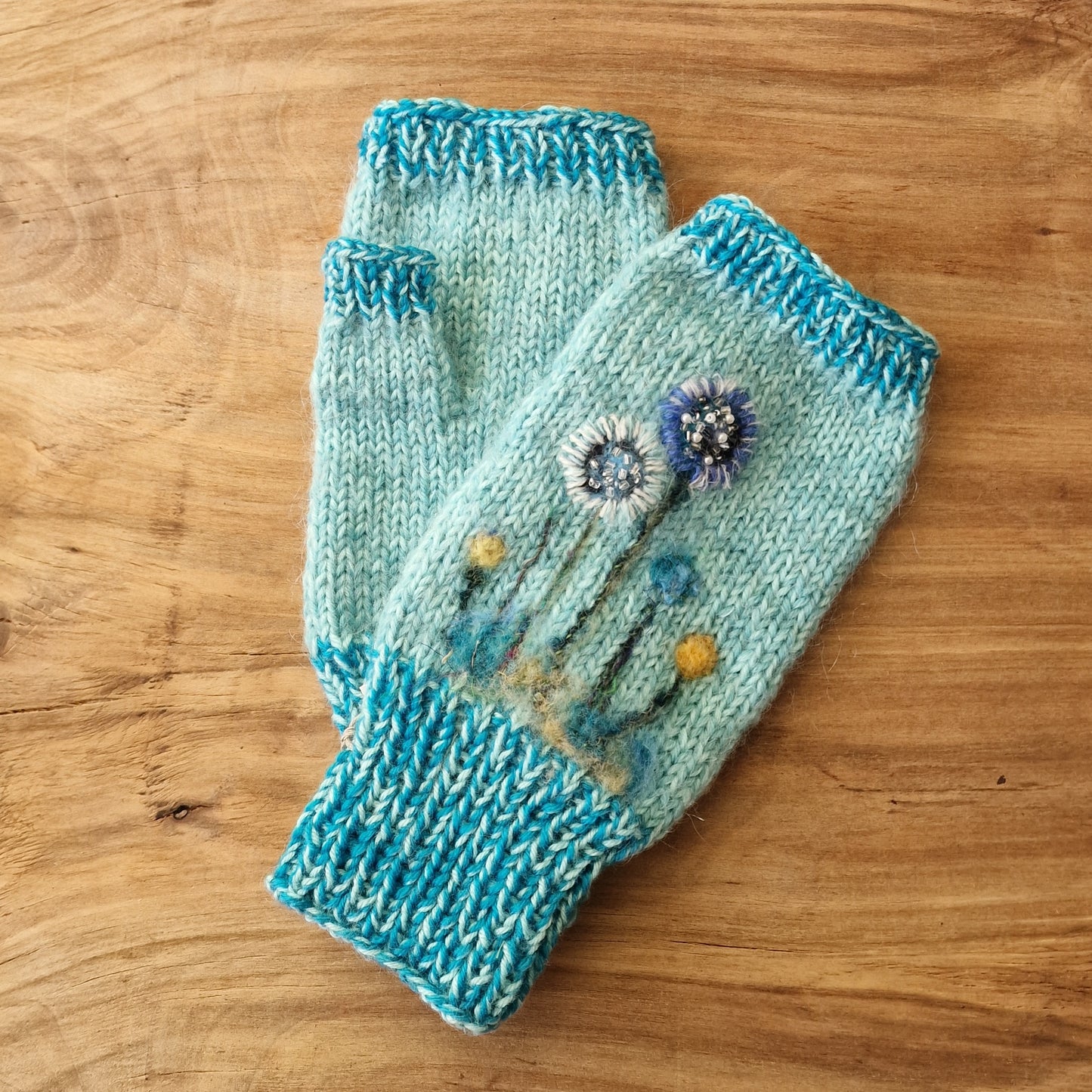 Light blue knitted half gloves with embroidered flowers (ALMA 56)